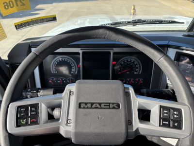 Mack PI64 truck steering wheel and dashboard view showing steering wheel with MACK logo and instrument cluster