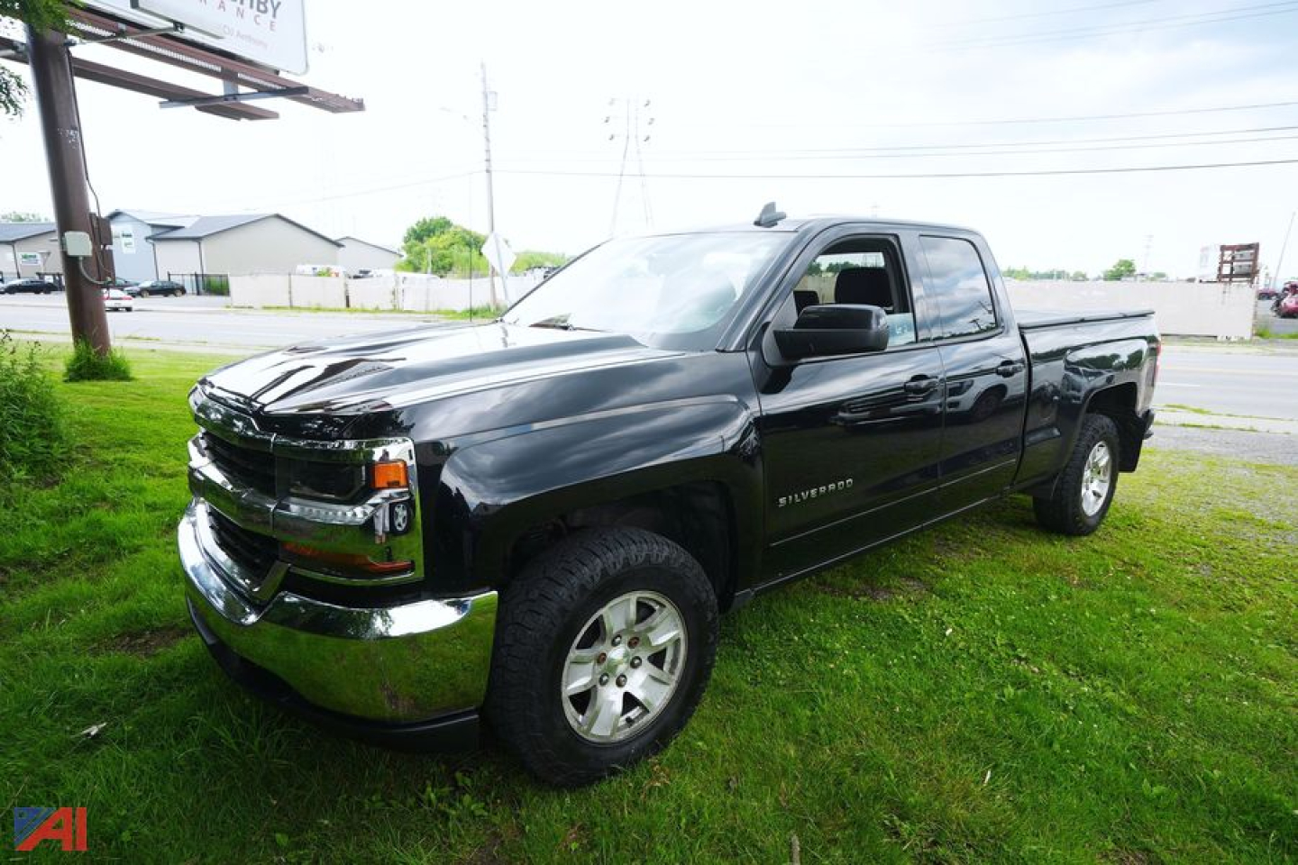 2008? 2018 Chevrolet Silverado Crew Cab pickup with 80-inch longbed in black, front three-quarter view, four-wheel drive.