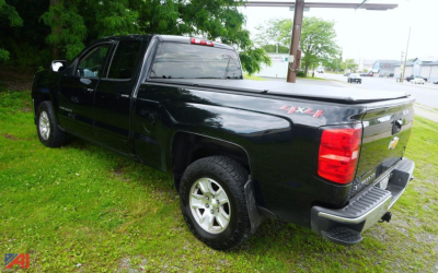 Truck bed view of a black 2018 Chevrolet Silverado Crew Cab 4x4 with 80" long bed, showing the rear and passenger side with Silverado 4x4 badge.