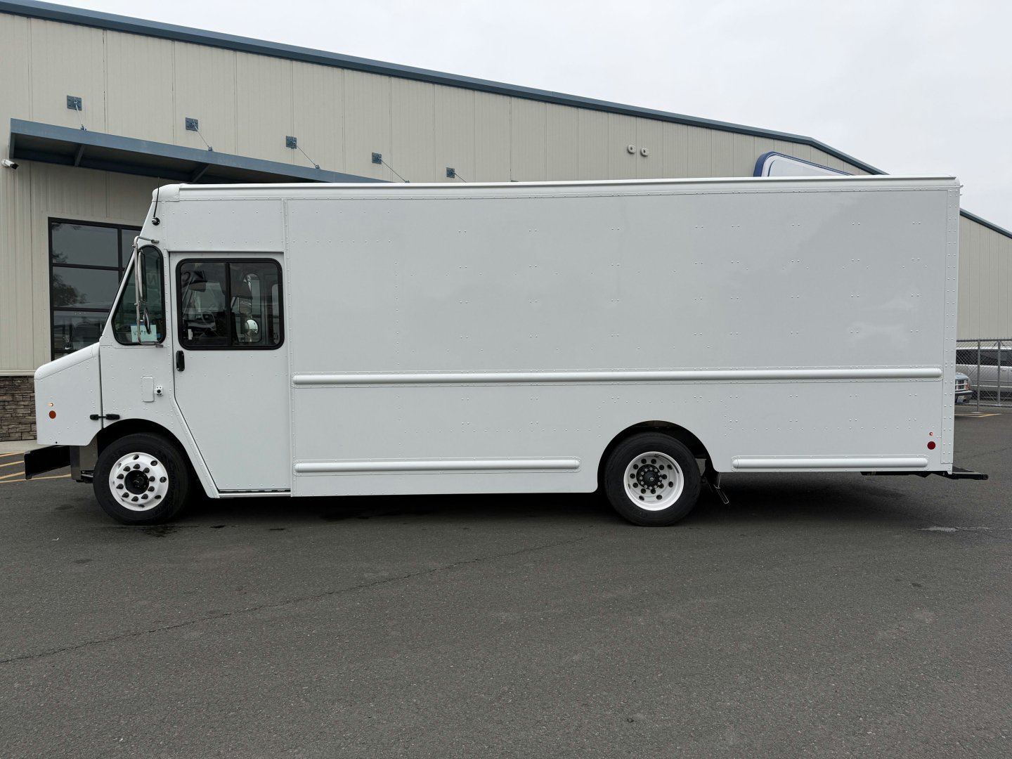 Harbinger S655 box truck side view showing cargo box and cab with white exterior livery.