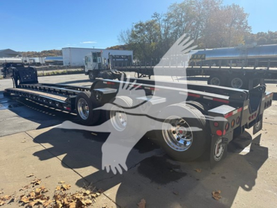 2026 Fontaine Magnitude 60Hd Mdsr trailer showing lowboy deck and rear axles with wheels and branding visible.