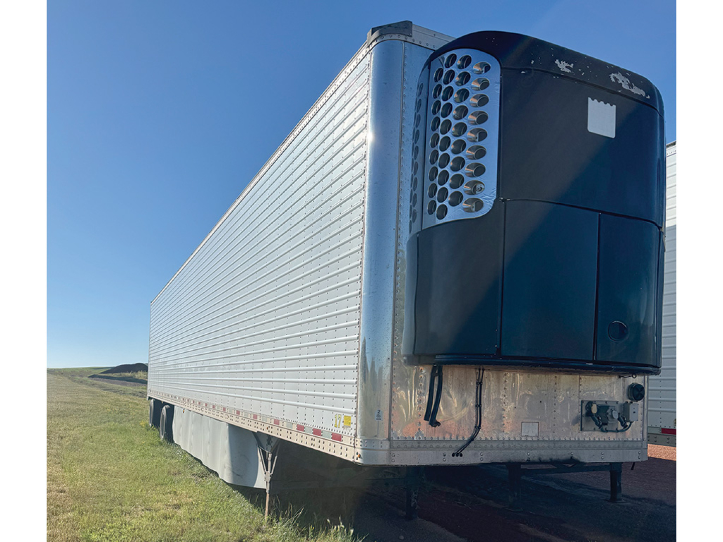 Great Dane Everest SS reefer trailer front-right view showing refrigeration unit and aluminum side walls.