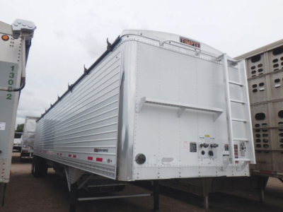 Timpte hopper trailer rear view showing metal corrugated sides, rear doors, and Timpte branding.