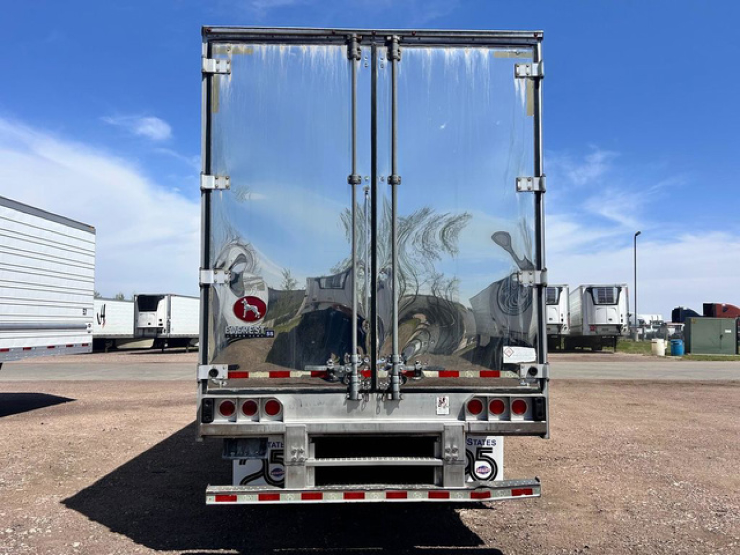 Great Dane reefer trailer back view showing reflective insulated doors and rear bumper with lights