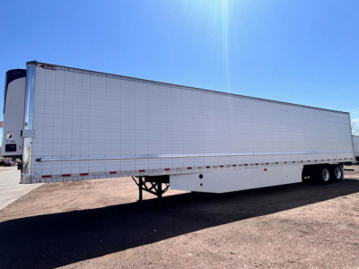 Great Dane reefer trailer side view showing aluminum panel body, tandem rear axles, long box, and refrigeration unit at front corner.