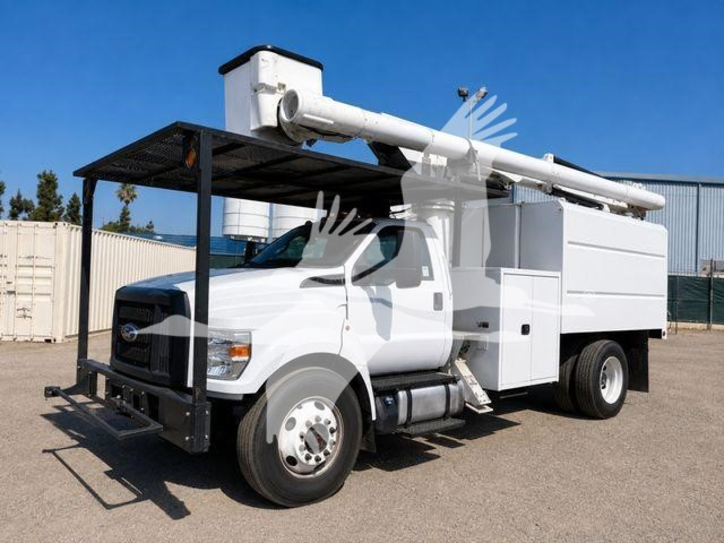 Ford F-750 bucket truck showing boom and Service/Utility body in-service; cab front view with platform and ladder hoist.
