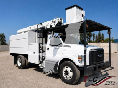 Ford F-750 bucket truck 2019 with elevated service boom and utility body, white cab and white cargo box, front view angled.