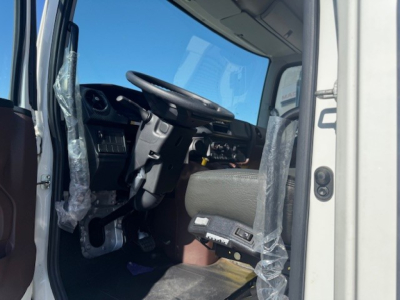 Cab and chassis interior view of a 2025 Hino L7 showing steering wheel, driver seat, and dashboard components.