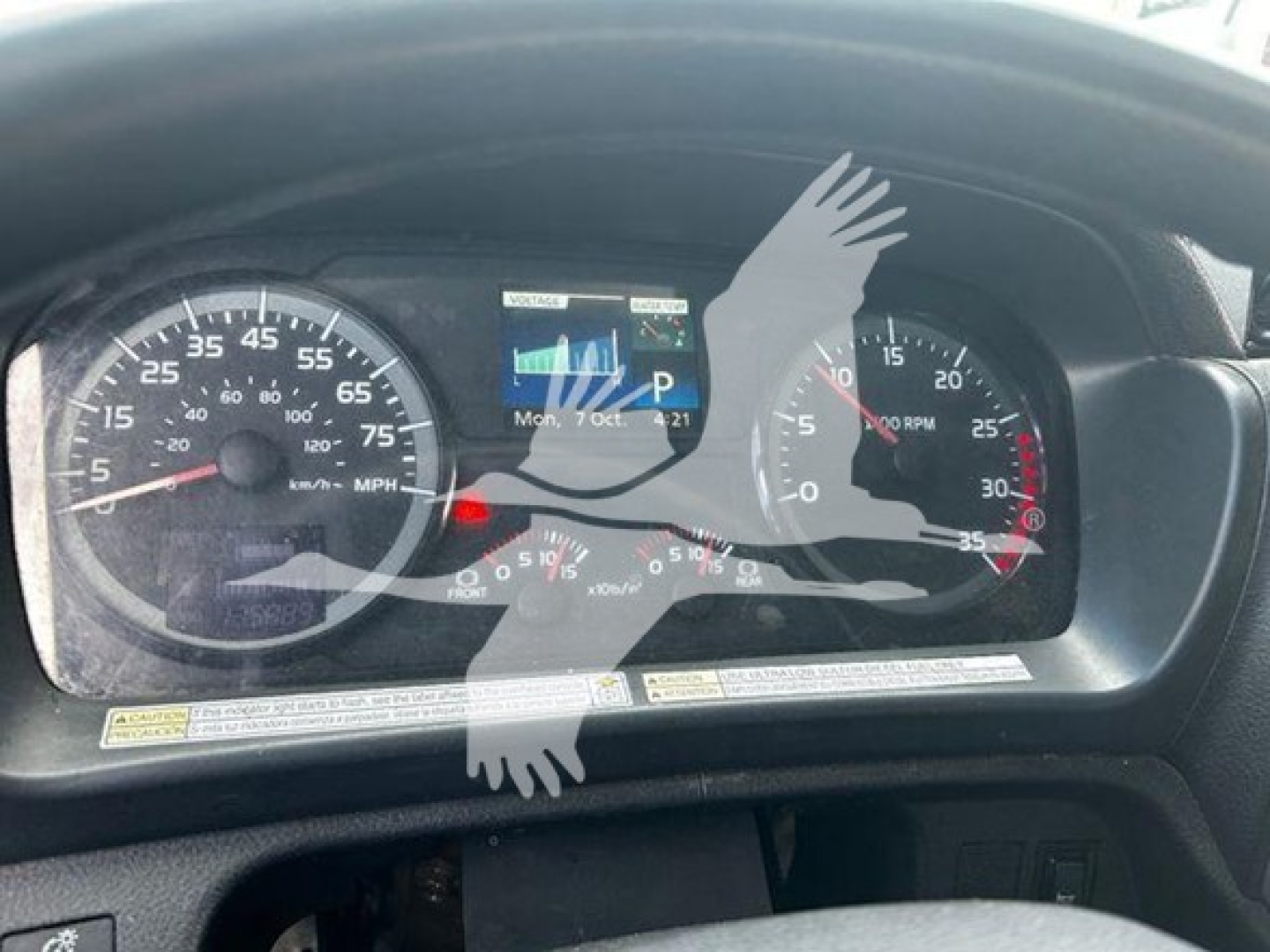 Dashboard of a used 2020 Hino 268a showing speedometer, tachometer, and digital display. Visible text includes fuel gauge, RPM markers, and diagnostic readout.