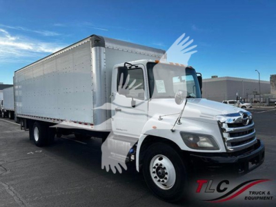 2020 Hino 268a box truck with a large cargo box, white cab, stock number T75035, VIN 5PVNJ8JV9L4S75035 visible in listing.