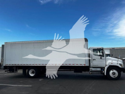 Truck side view of a 2020 Hino 268a box truck with VIN and stock number not visible on the vehicle.