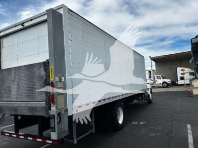Box truck with a silver/gray trailer showing a black rubber line, rear bumper, and undercarriage. Visible text on side panels and lighting areas.