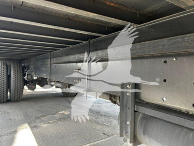 Underbody view of a 2020 Hino 268a box truck showing the chassis rails and frame with components near the wheel, no text visible.