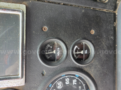 Ford LN8000F dash gauges showing voltmeter and ammeter and large speedometer/engine gauges.