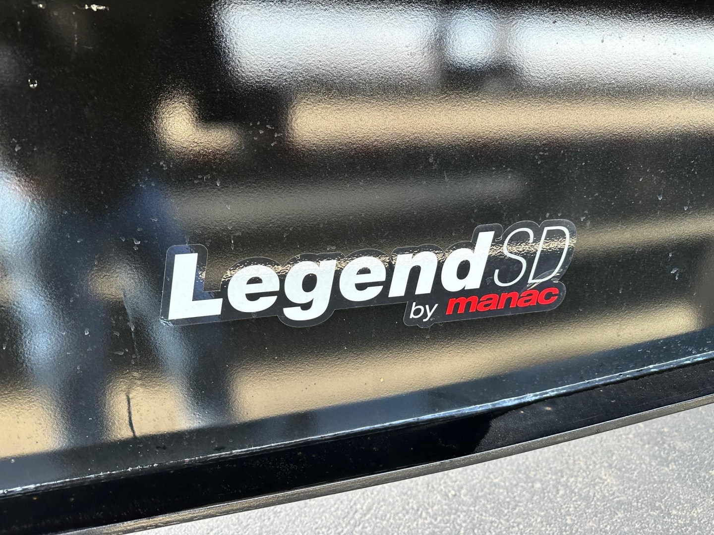 Legend SD by Manac badge on black trailer side showing 'LegendSD by manac' text.
