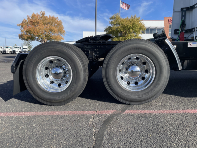 Dual rear tires of a 2026 Mack PR64T64 tractor chassis showing chrome wheels and tire treads.