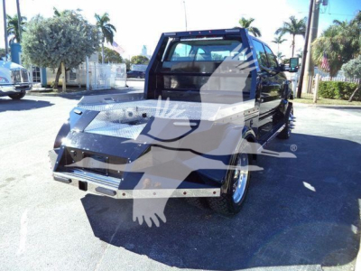 Flatbed tow truck showing rear and cab with watermark overlay