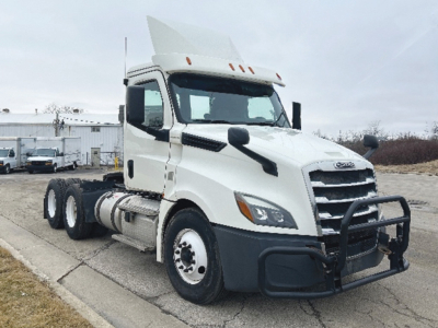 2009 Freightliner Cascadia126 semi truck cab in white with visor, black front bumper guard, dual rear axles, VIN 3AKJHLDV9KSKF1940 visible on listing; stock 557424.