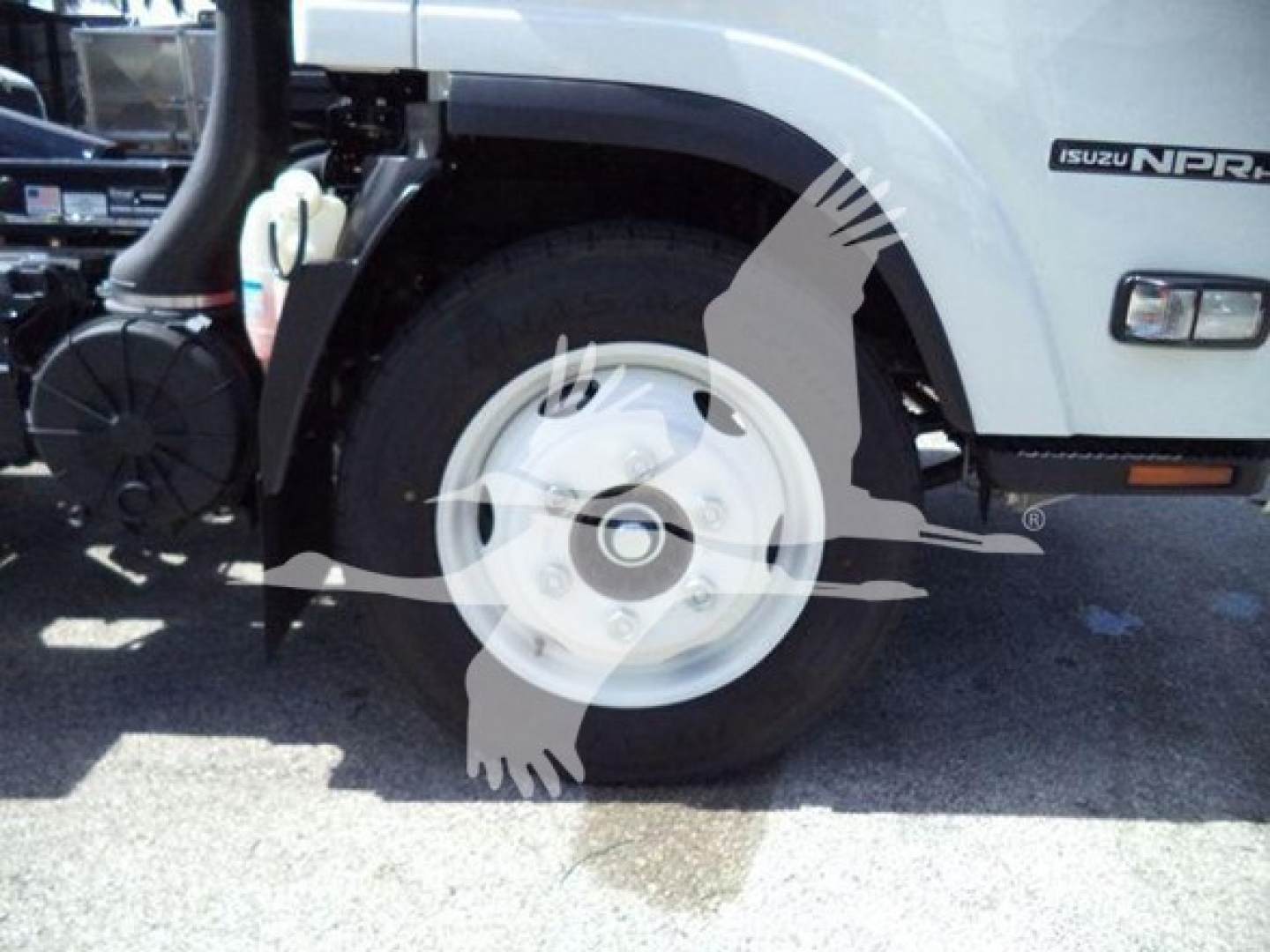 Isuzu NPR HD truck front-left wheel area with part of the cab and Hooklift label visible.