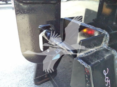 Isuzu NPR-HD hooklift truck coupling hook and receiver mounting point with metal frame and painted black surface.