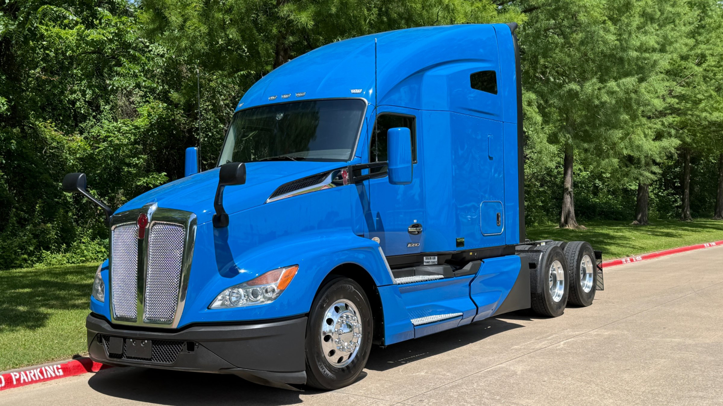 Kenworth T680 tractor in blue view showing front and side with sleeper cab and wheel axles.