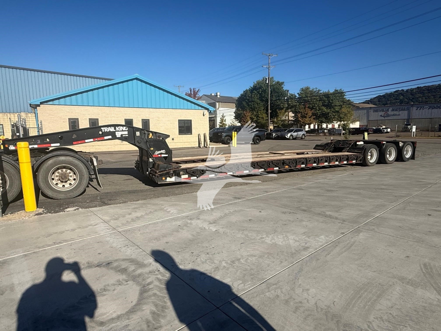 Trail King TK110Hdg lowboy trailer in service showing long flatbed with gooseneck arm and multiple axles.