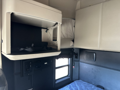 Kenworth T680 cabin interior showing storage shelf and side window view