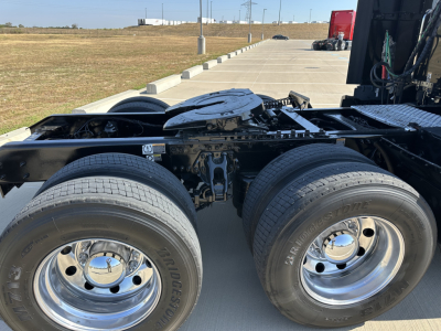 Kenworth T680 chassis showing dual rear axle wheels and fuel tanks with visible wheels and undercarriage.
