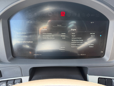 Kenworth T680 dashboard display showing chassis and engine information on a digital screen.