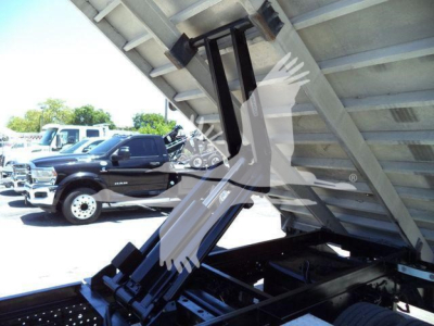 Isuzu NPR Hd dump truck bed showing hydraulic lift and chassis components.