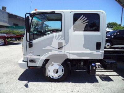 Isuzu NPR HD cab-forward truck side view showing front wheel, door, and steps with stock markings.