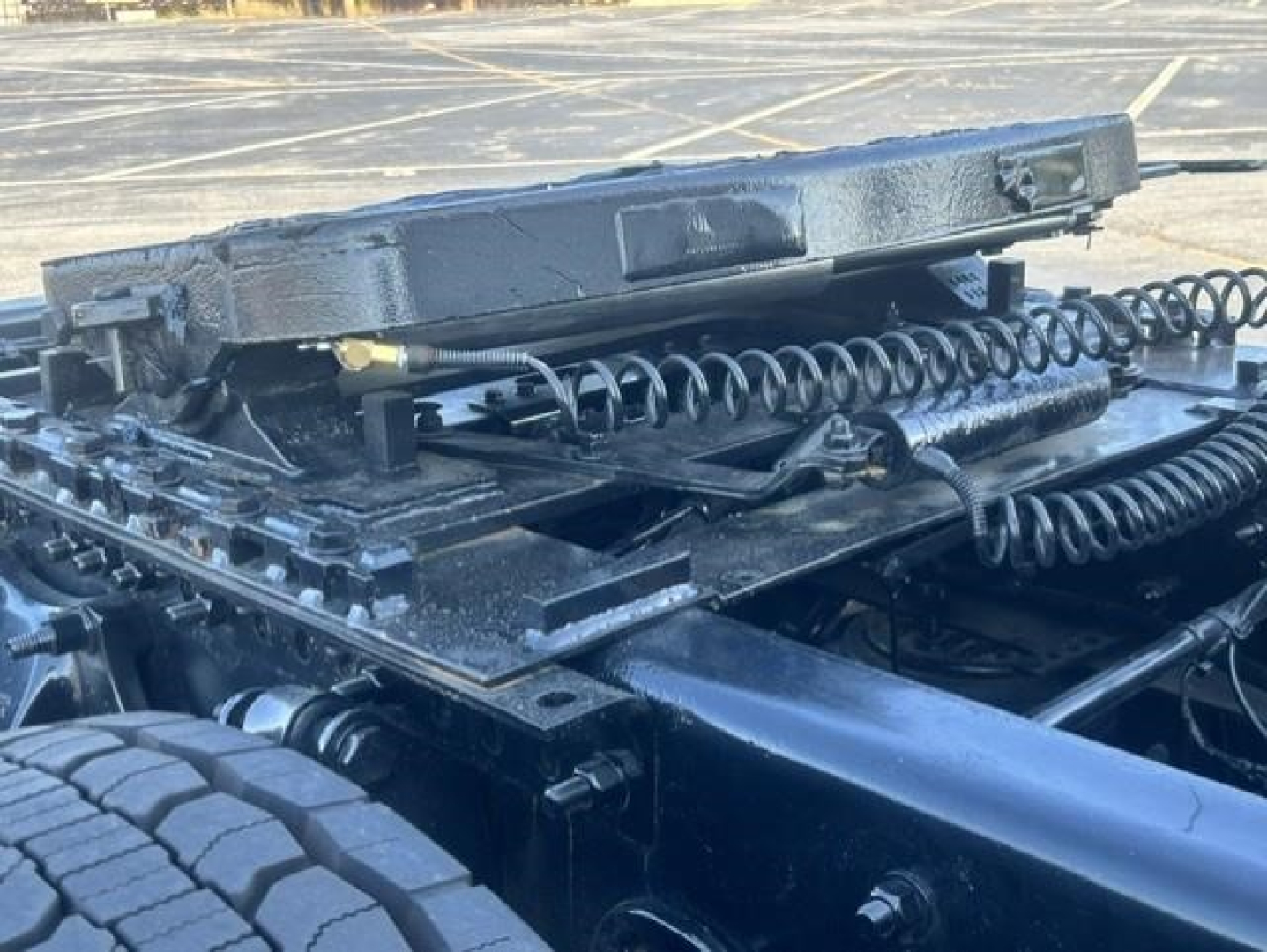 Freightliner Cascadia cab chassis showing suspension components and jump/air lines.
