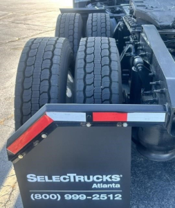 Freightliner Cascadia 126 truck rear view showing dual rear axles and trailer hitch area with SelectTrucks Atlanta logo and phone number.