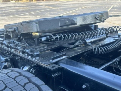 Freightliner Cascadia cab chassis showing suspension components and jump/air lines.