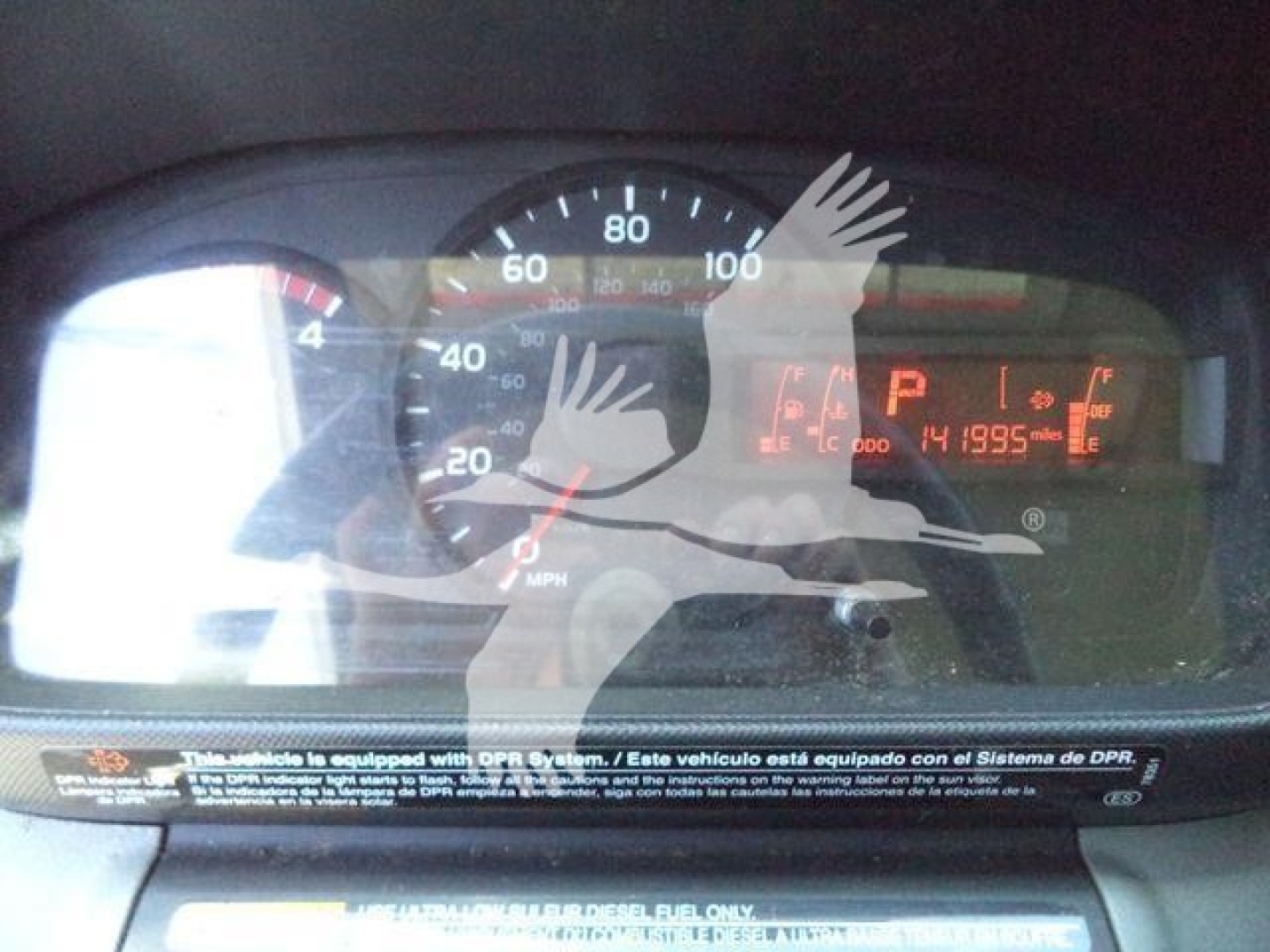 Dashboard of a 2020 Hino 195 dump truck showing speedometer, fuel gauge, tachometer, and digital display with numbers and warning indicators.