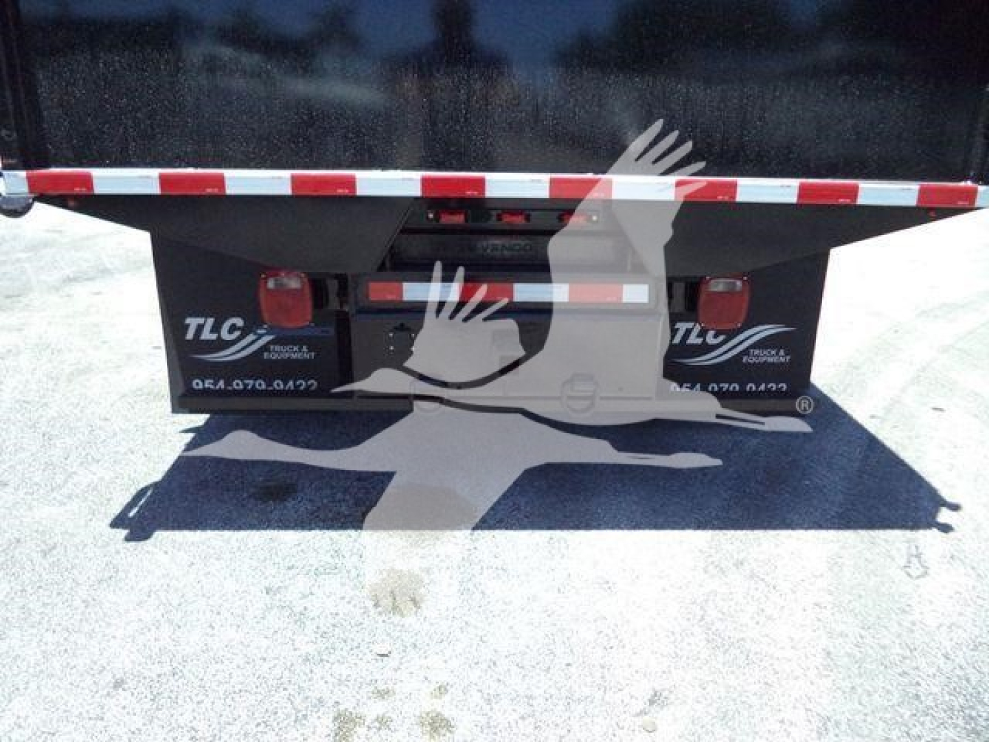 Hino 195 dump truck rear showing TLC/underbody area with tailgate area and bumper hardware.