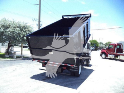 Dump truck rear and side view showing 2020 Hino 195 dump bed in raised position, with wheel and rear taillights visible.