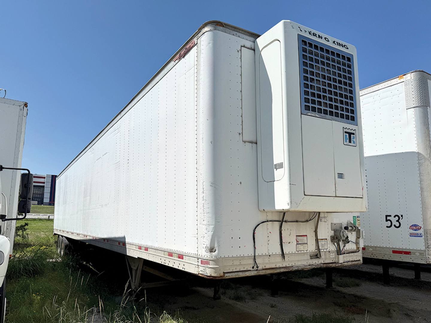 Great Dane aluminum reefer trailer with front refrigeration unit on a long white body.