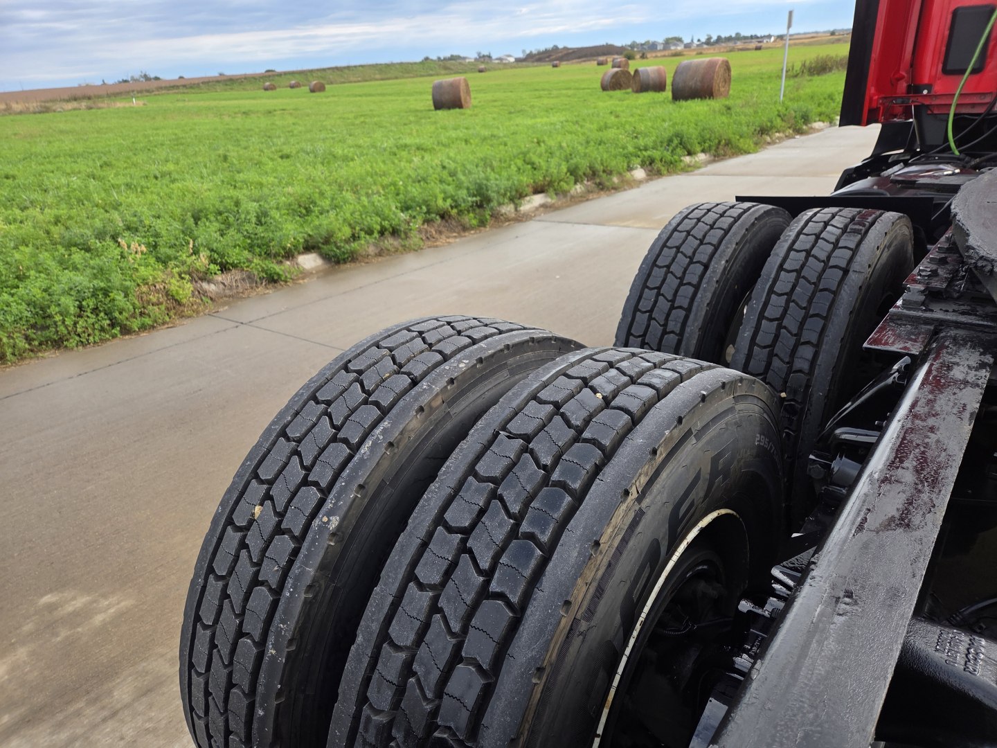 Kenworth T680 rear dual tires and chassis showing tire tread and wheel assembly.