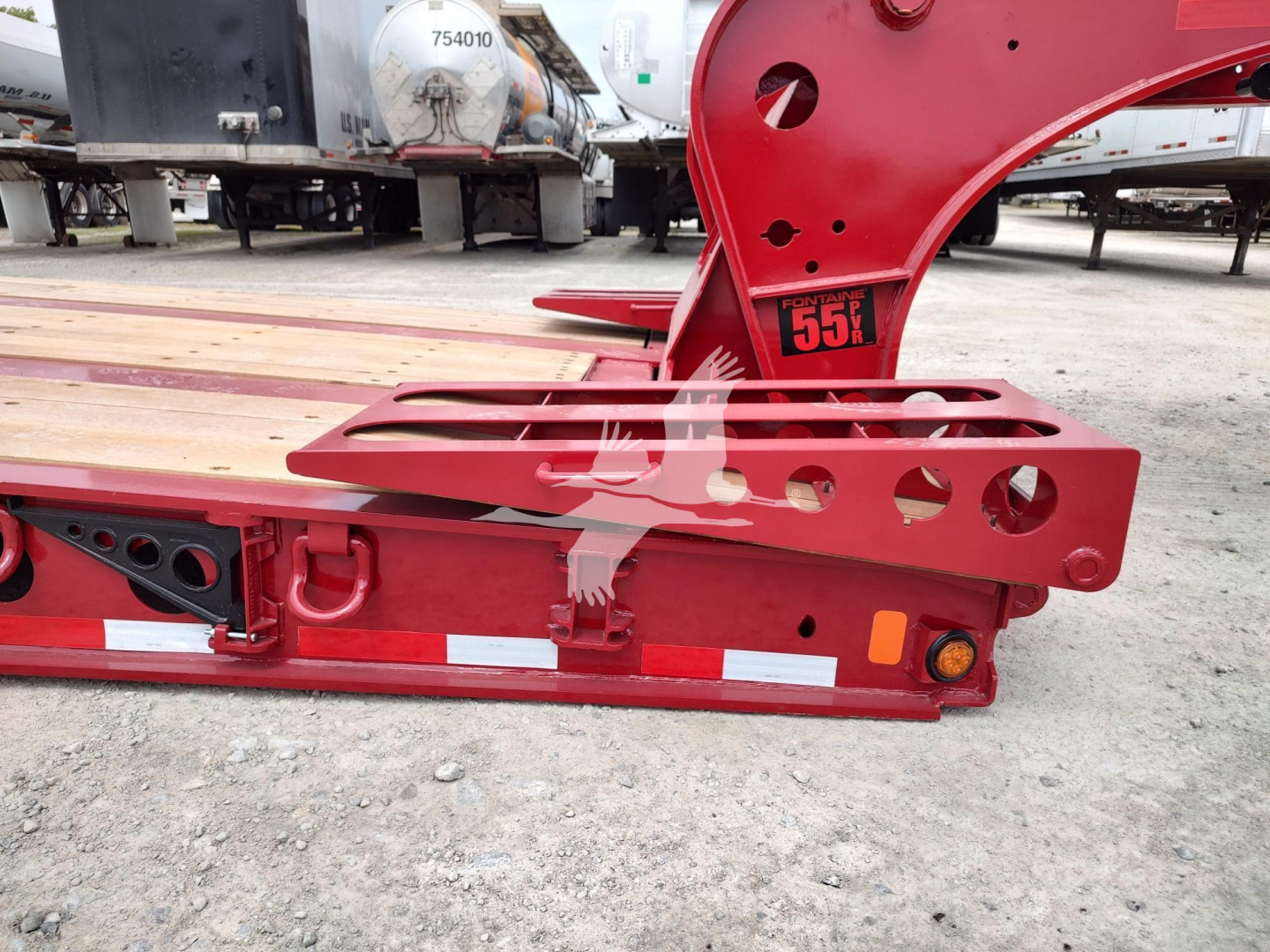 Fontaine paver trailer component with red frame showing around 75-inch offset and structural channels; visible labels include '7550' and cutouts for mounting.