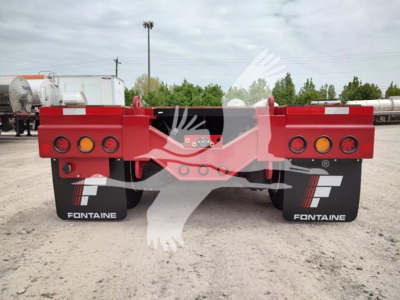 Fontaine Paver Pro lowboy trailer rear view showing taillights and FONTAINE mudflaps with white logo