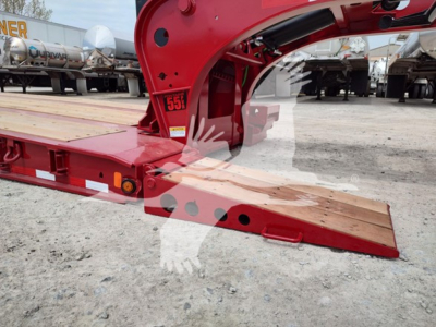Fontaine paver trailer side view showing red frame and wooden loading ramp; VIN tag area and stock number V35A6665 visible