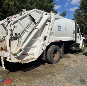 Garbage truck side and rear view of a 2013 Freightliner M2 106 waste collection vehicle showing rear compactor and side cab area.