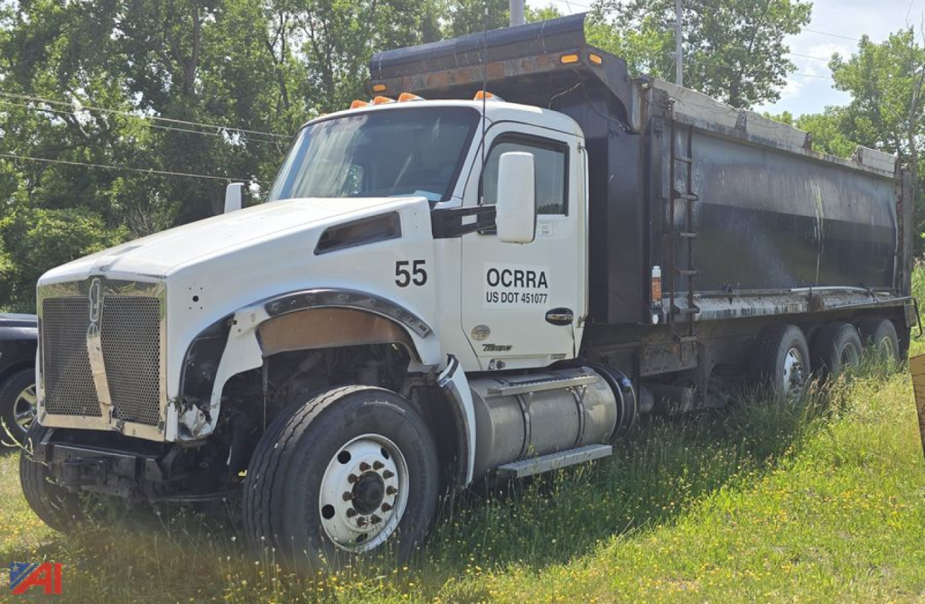 Kenworth T880 dump truck in-service showing cab and long dump body with black bed and raised tarp, number 55 on door and OCRRA markings.