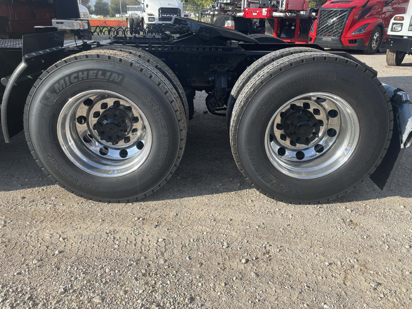 Volvo VNL64T860 tractor rear dual rear wheels showing Michelin tires and chrome wheels.