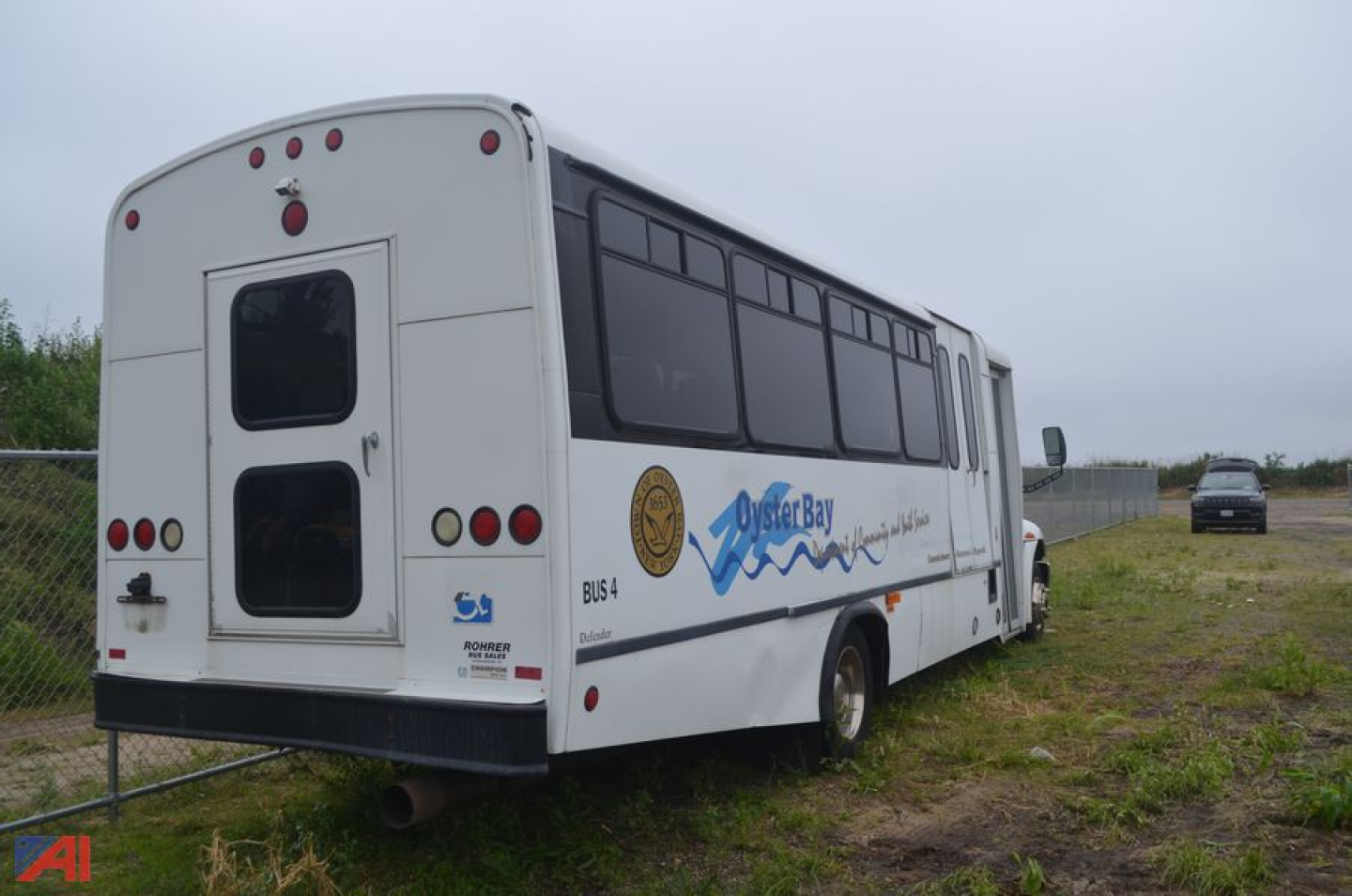 2009 International 3200 bus rear and side view with logos and windows