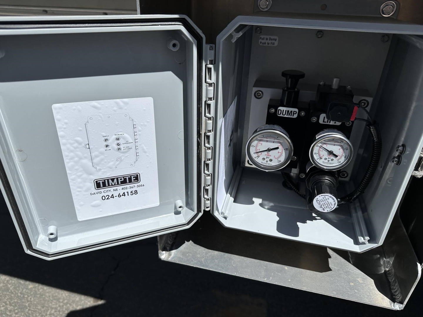 Timpte hopper trailer accessory box with dual pressure gauges and control valves visible inside open compartment, 78-inch sides noted on listing.