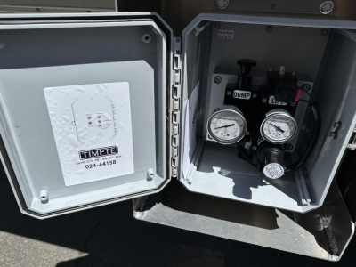 Timpte hopper trailer accessory box with dual pressure gauges and control valves visible inside open compartment, 78-inch sides noted on listing.