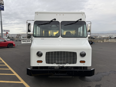 Harbinger S525 step van front view showing grille, headlights, and bumper.