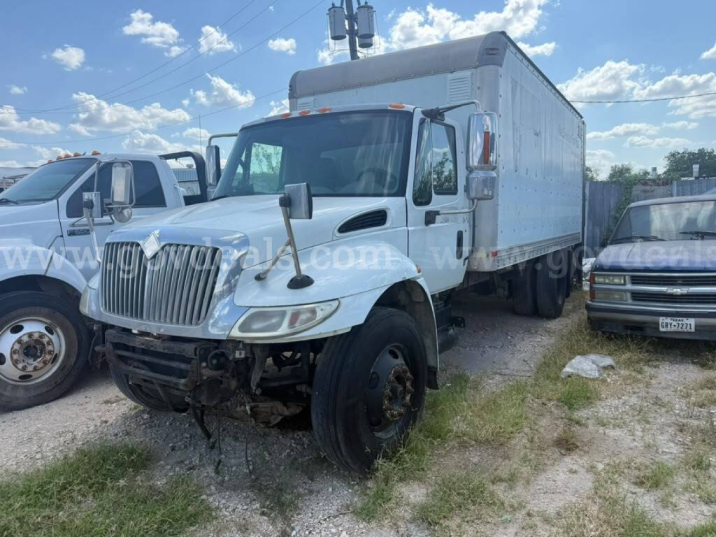 Box truck chassis showing front with grille and dual mirrors, International 4400, stock image text not legible.